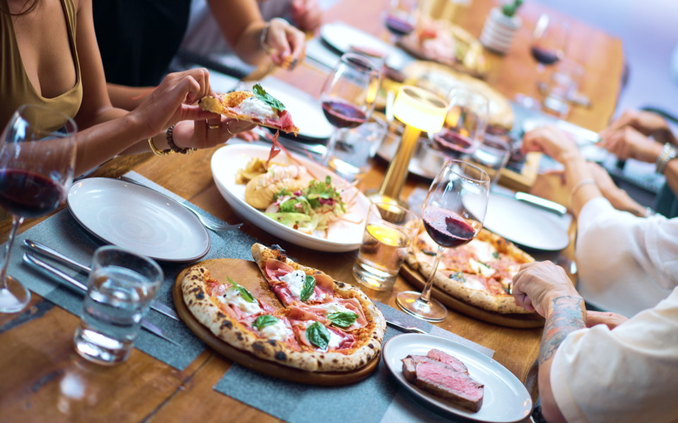 Diners enjoying some of the best pizzas in Karon Beach, Phuket