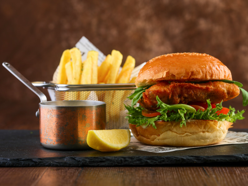 Burger served with sauce lemon and fries