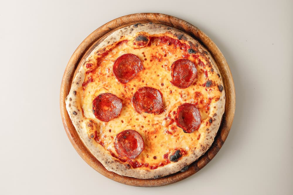 a pepperoni pizza from Ciao Pizza & Grill which pairs well with Chianti