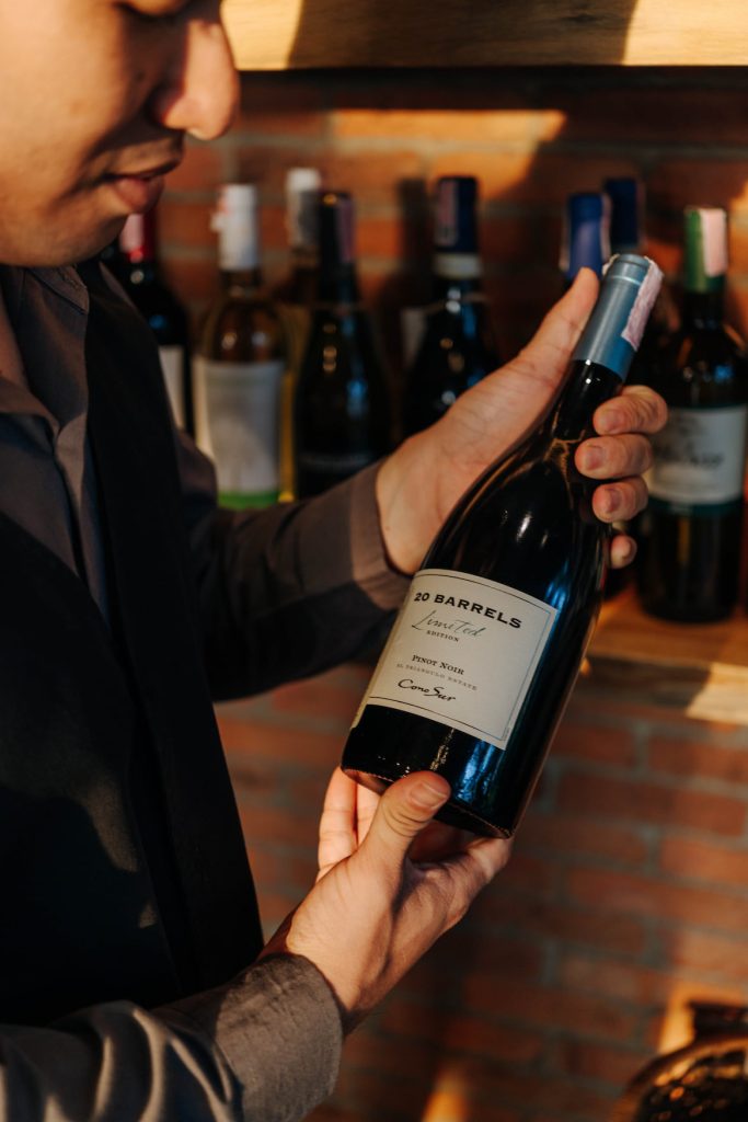 A Person Holding Wine Bottle