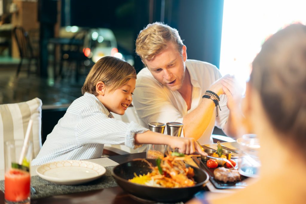 Father And Kid Enjoying Food