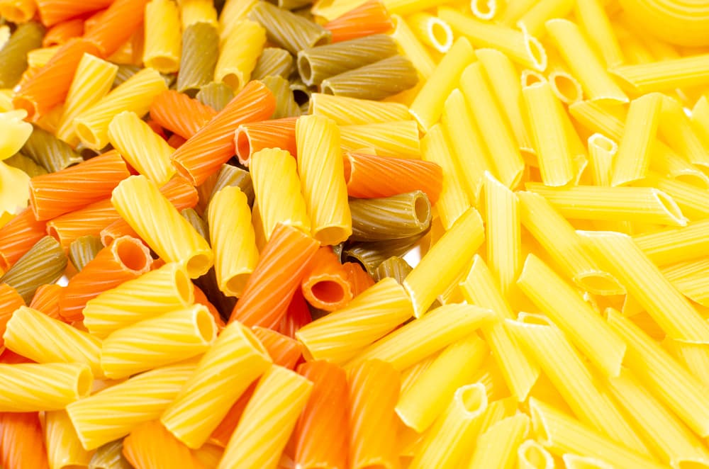 A colorful display of penne and rigatoni dried pasta
